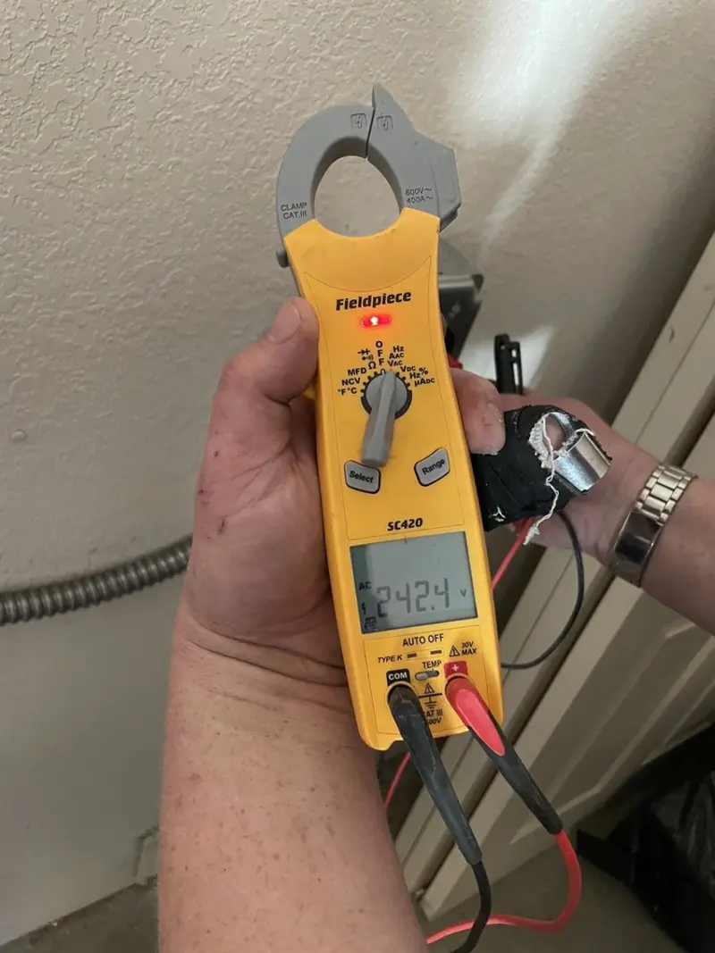 Voltage testing with clamp meter during Ceiling Fan Installation in Greenville